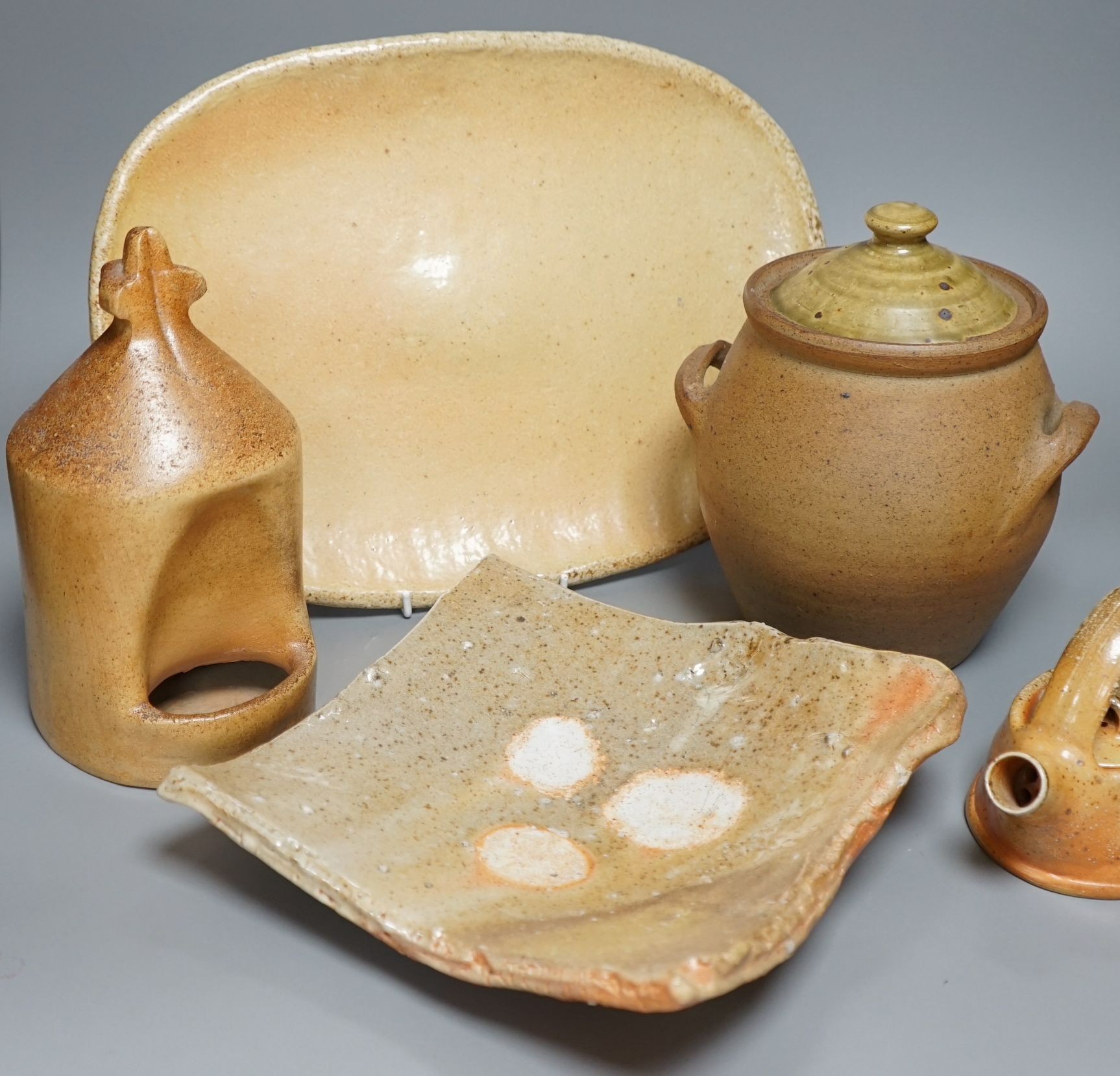 British studio pottery; a group to include a Micki Schloessingk (b.1949) salt glaze teapot and cover, together with other similar items and other studio pottery wares, largest 39cm wide, (5)